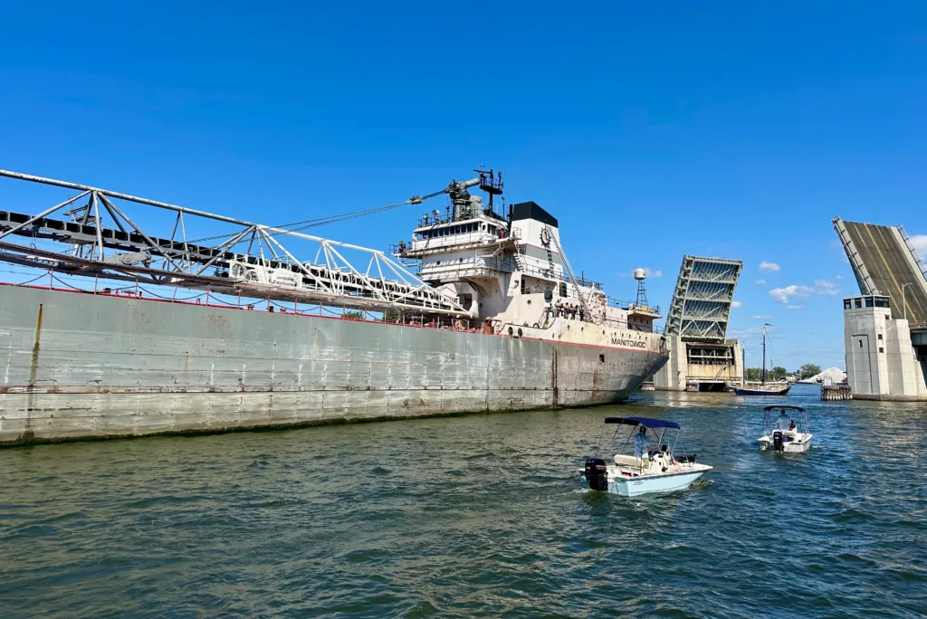 Small day boat cruising by commercial boat