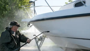 A man cleaning his boat