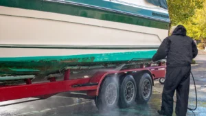 A man sprucing up his boat