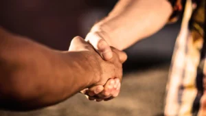Two people agreeing to sell 